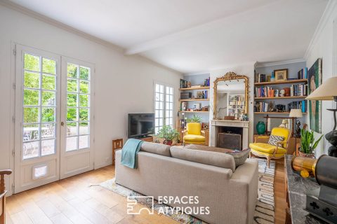 Renovated townhouse with paved courtyard and elevation.