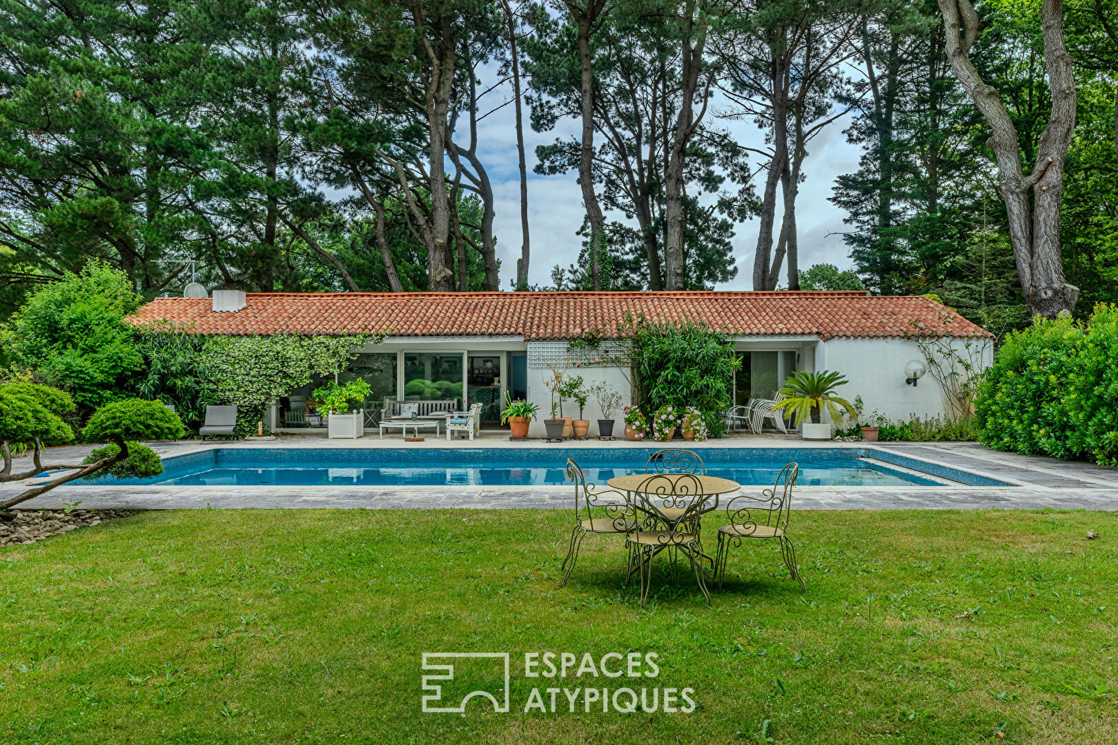 Architect-designed 70s house with a summer home on a park