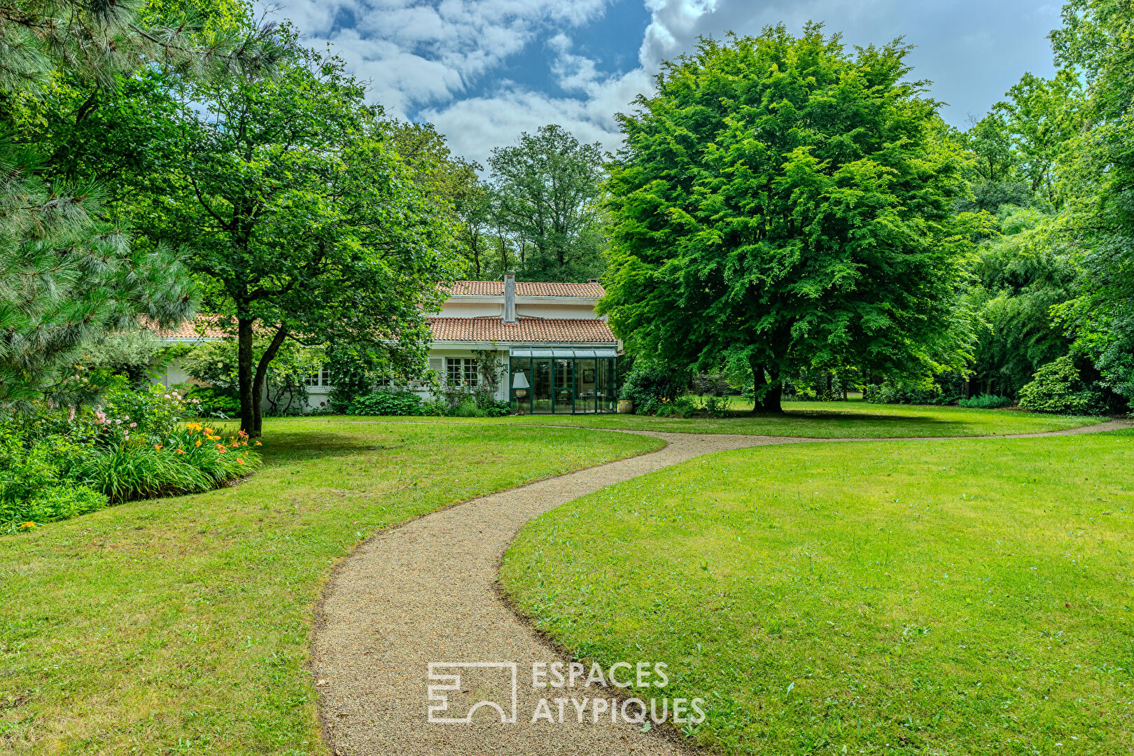 Architect-designed 70s house with a summer home on a park