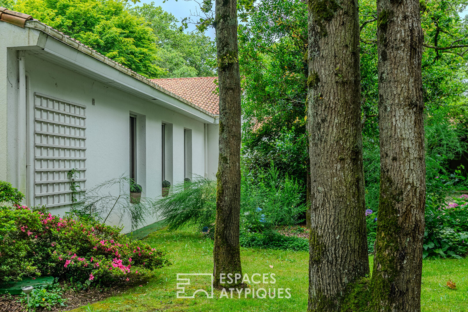 Architect-designed 70s house with a summer home on a park