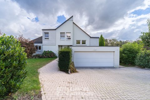 Architect-designed house with wooded garden