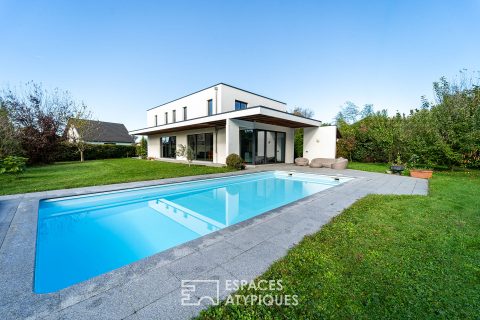 Contemporary villa with swimming pool set in greenery