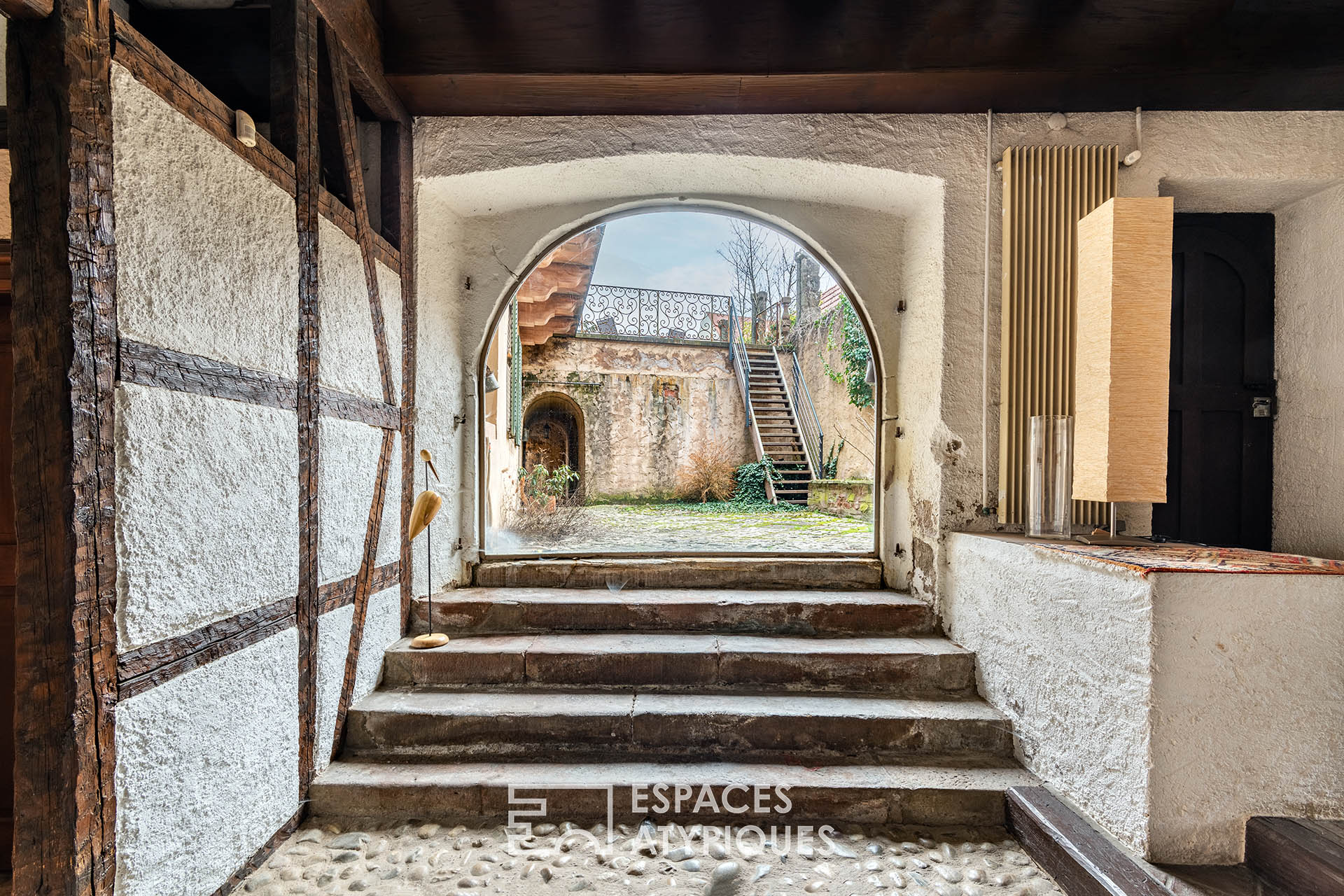 Former 17th century abbey and its fireplace Jacques Couëlle