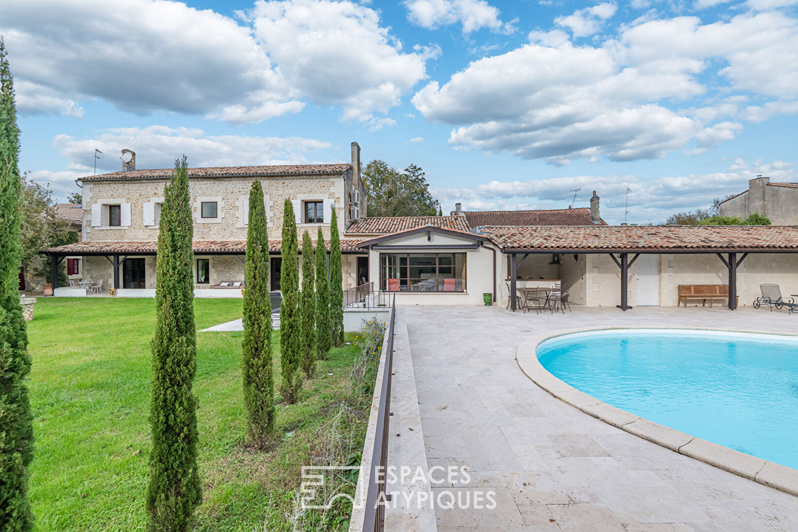 Stone mansion with swimming pool and outbuilding