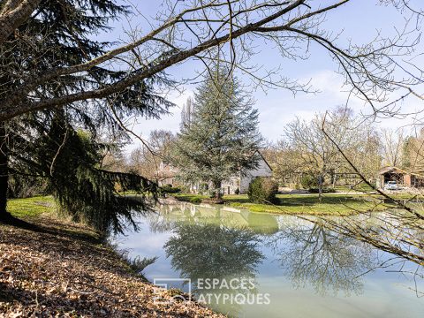 Longère et son étang dans un vaste parc arboré