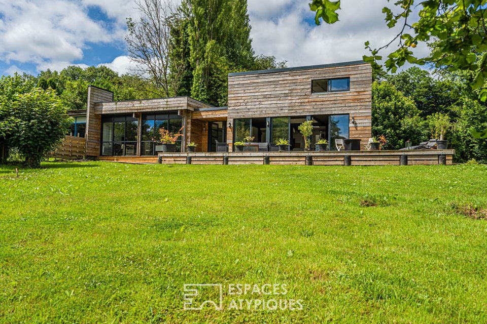 Maison d'Architecte ossature bois dans un écrin verdoyant