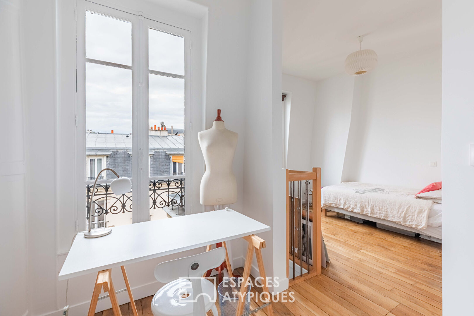 Haussmannian duplex on a high floor with south-facing balconies in Auteuil Nord