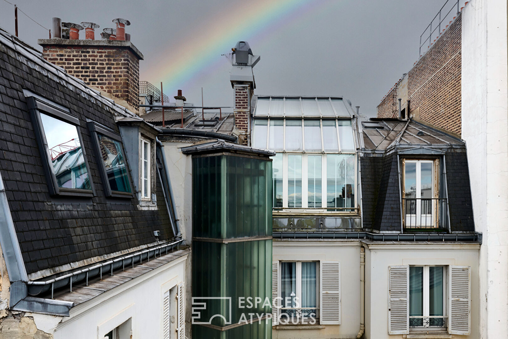Haussmannian top floor with workshop glass roof and views near Etoile