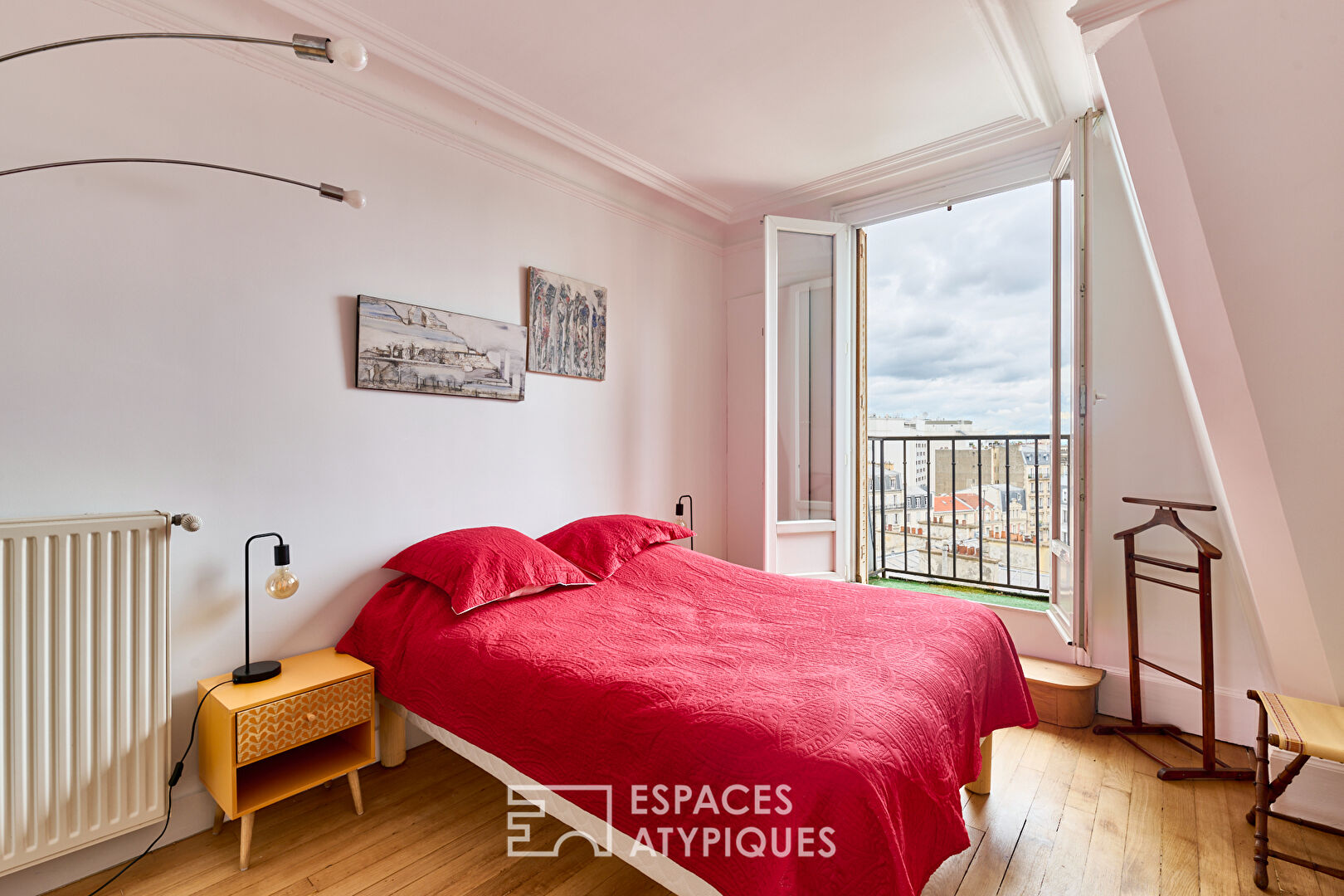 Haussmannian top floor with workshop glass roof and views near Etoile