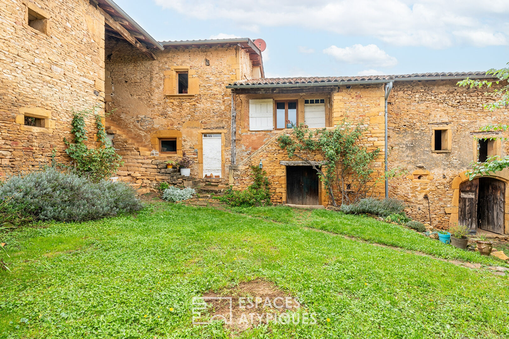 Golden stone house with great potential