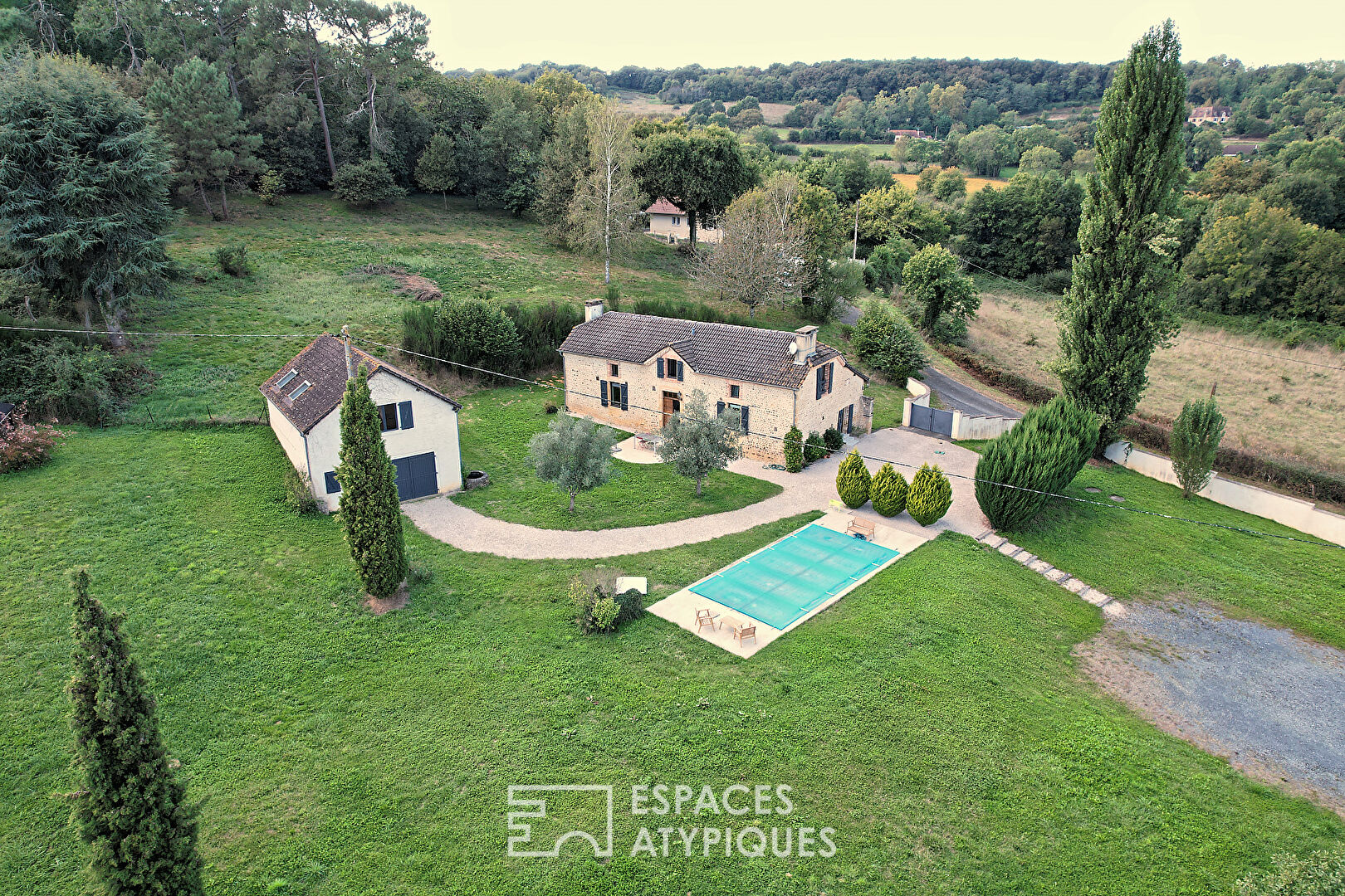 Charming pebble house with swimming pool and outbuilding surrounded by nature