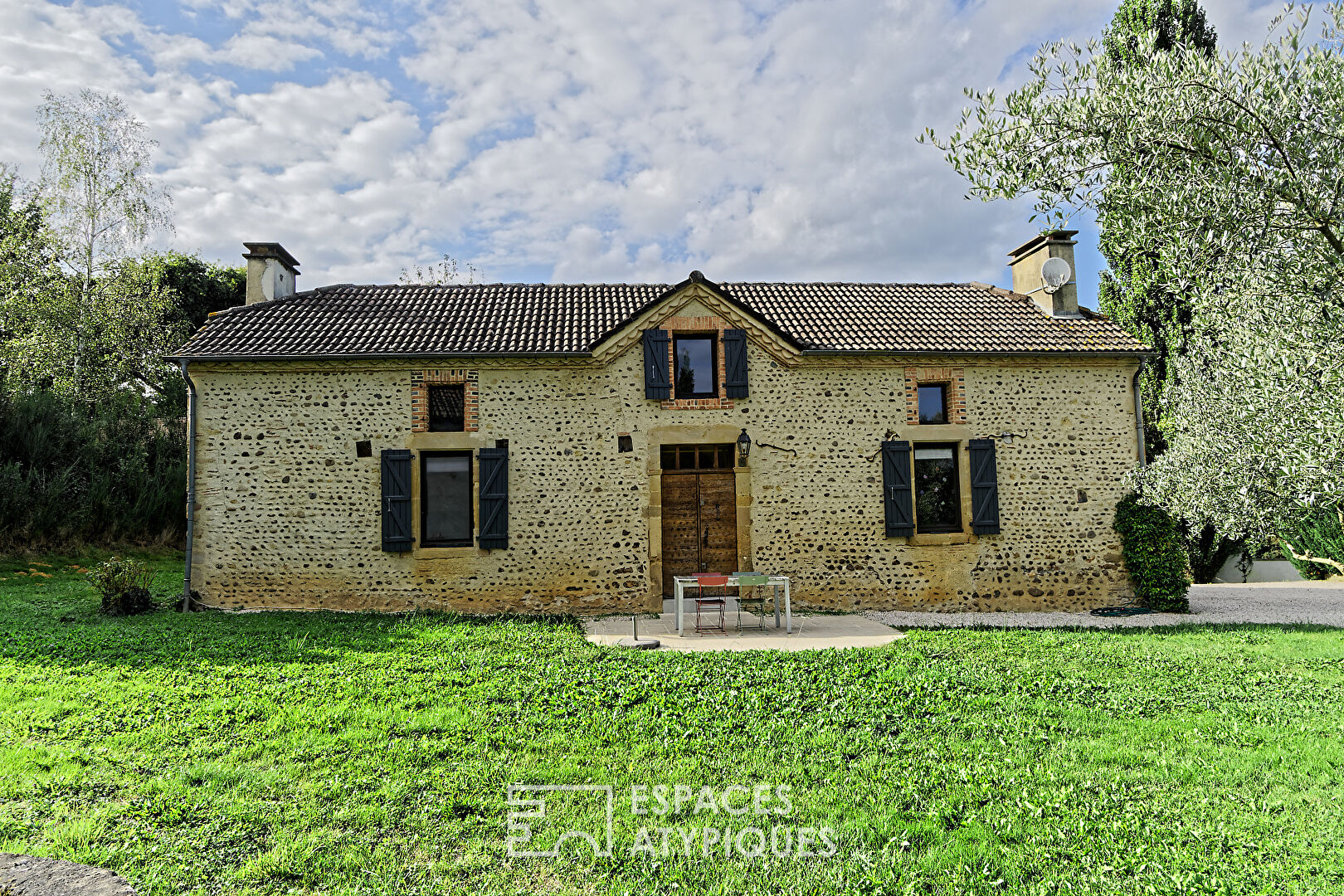 Charming pebble house with swimming pool and outbuilding surrounded by nature