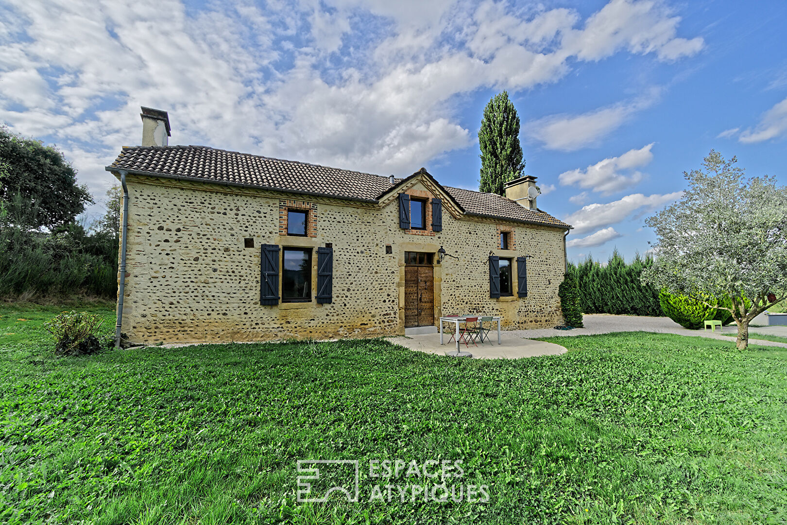 Charming pebble house with swimming pool and outbuilding surrounded by nature