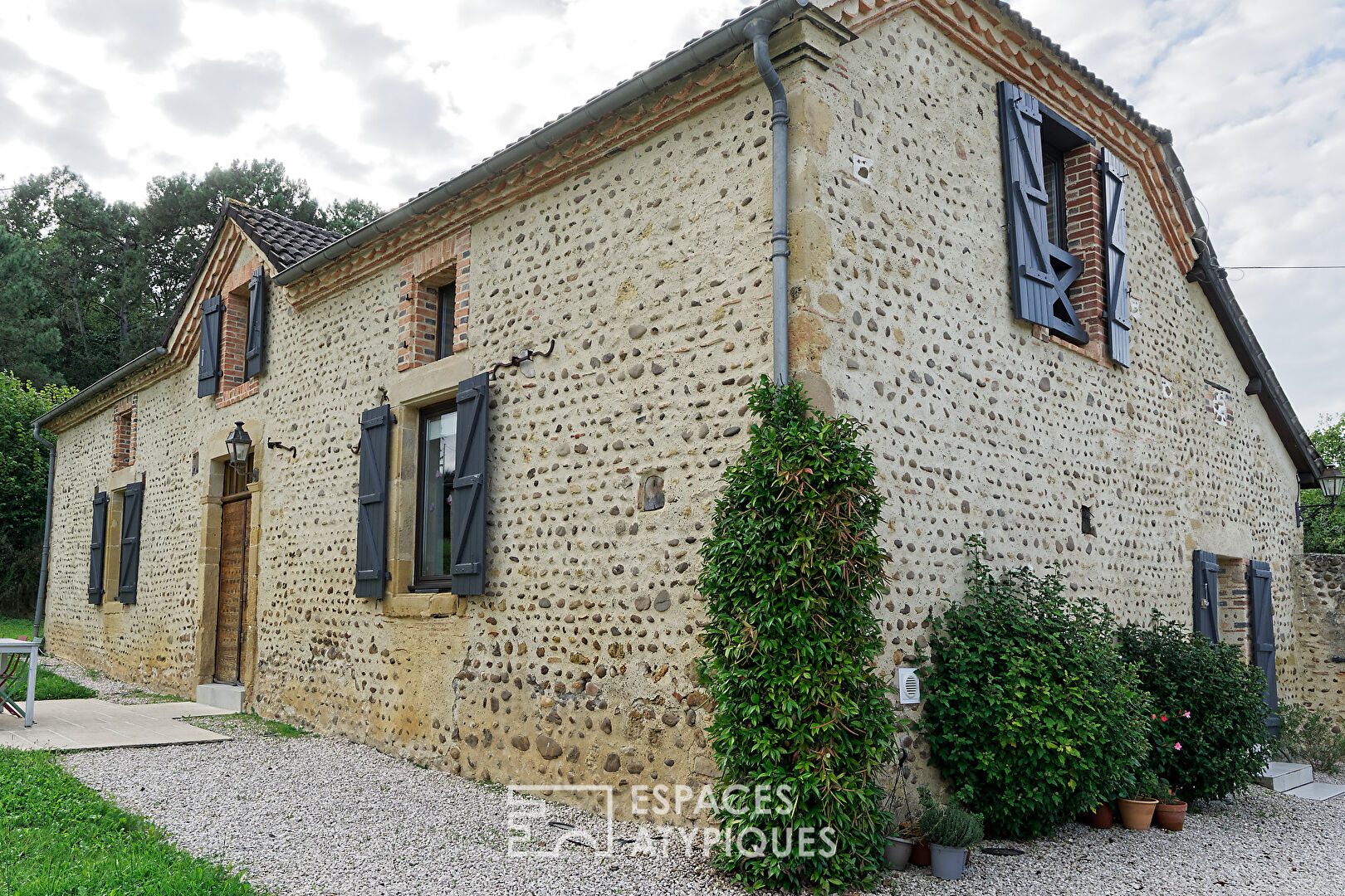 Charming pebble house with swimming pool and outbuilding surrounded by nature