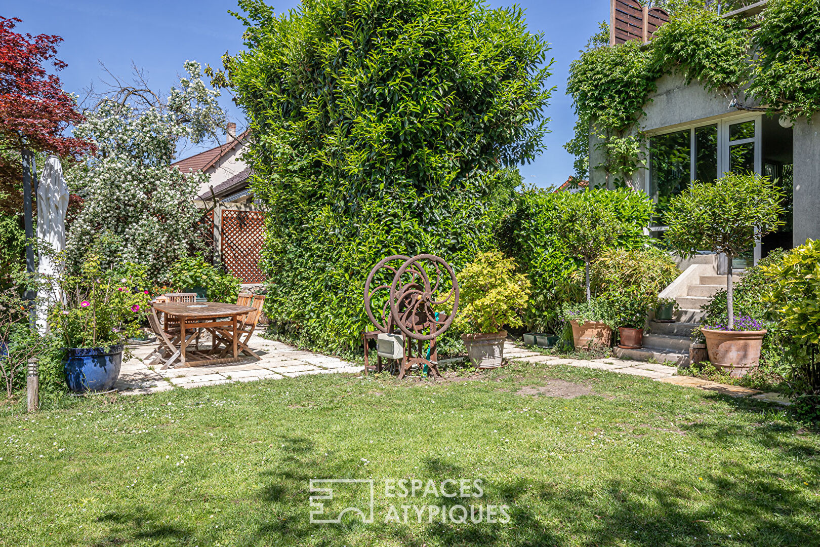 Late 19th century millstone with garden and terrace