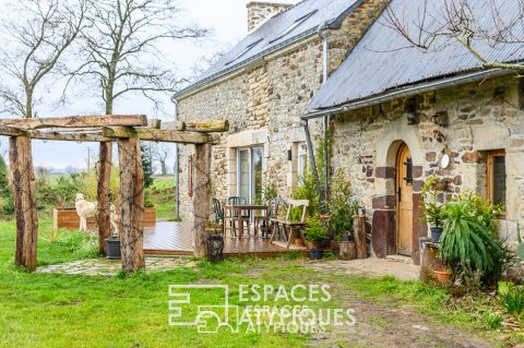 Authenticité et charme : longère en pierre avec jardin paysagé