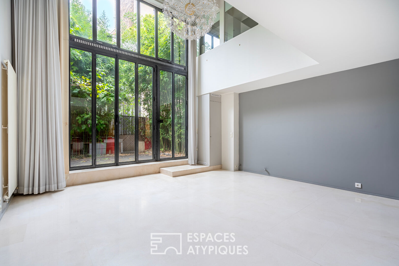 Loft en duplex avec terrasse arborée