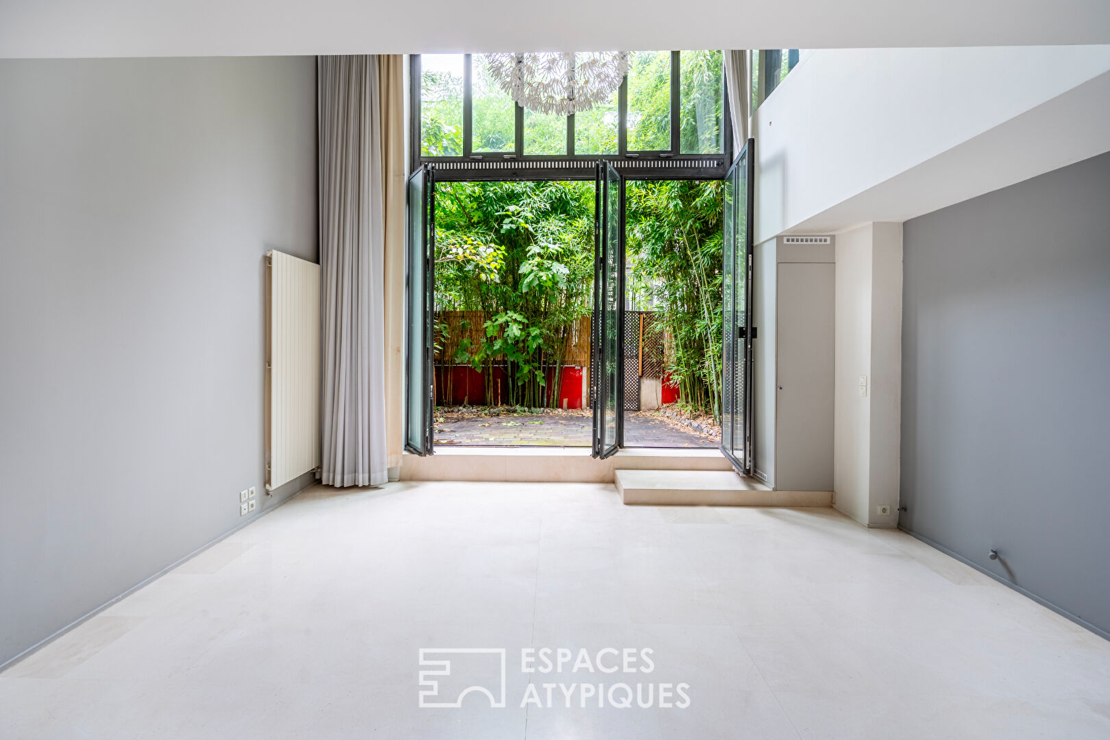 Loft en duplex avec terrasse arborée