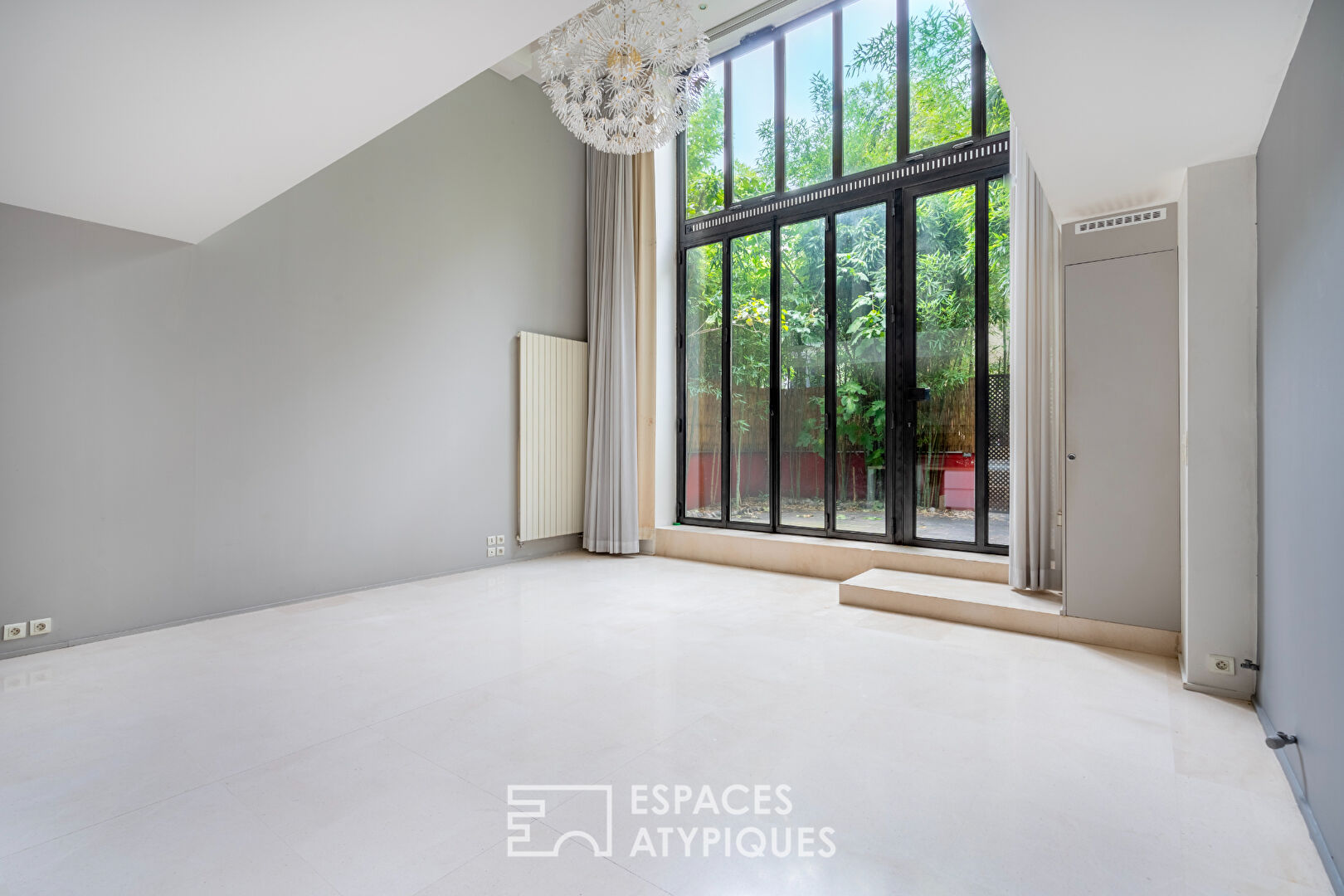 Loft en duplex avec terrasse arborée