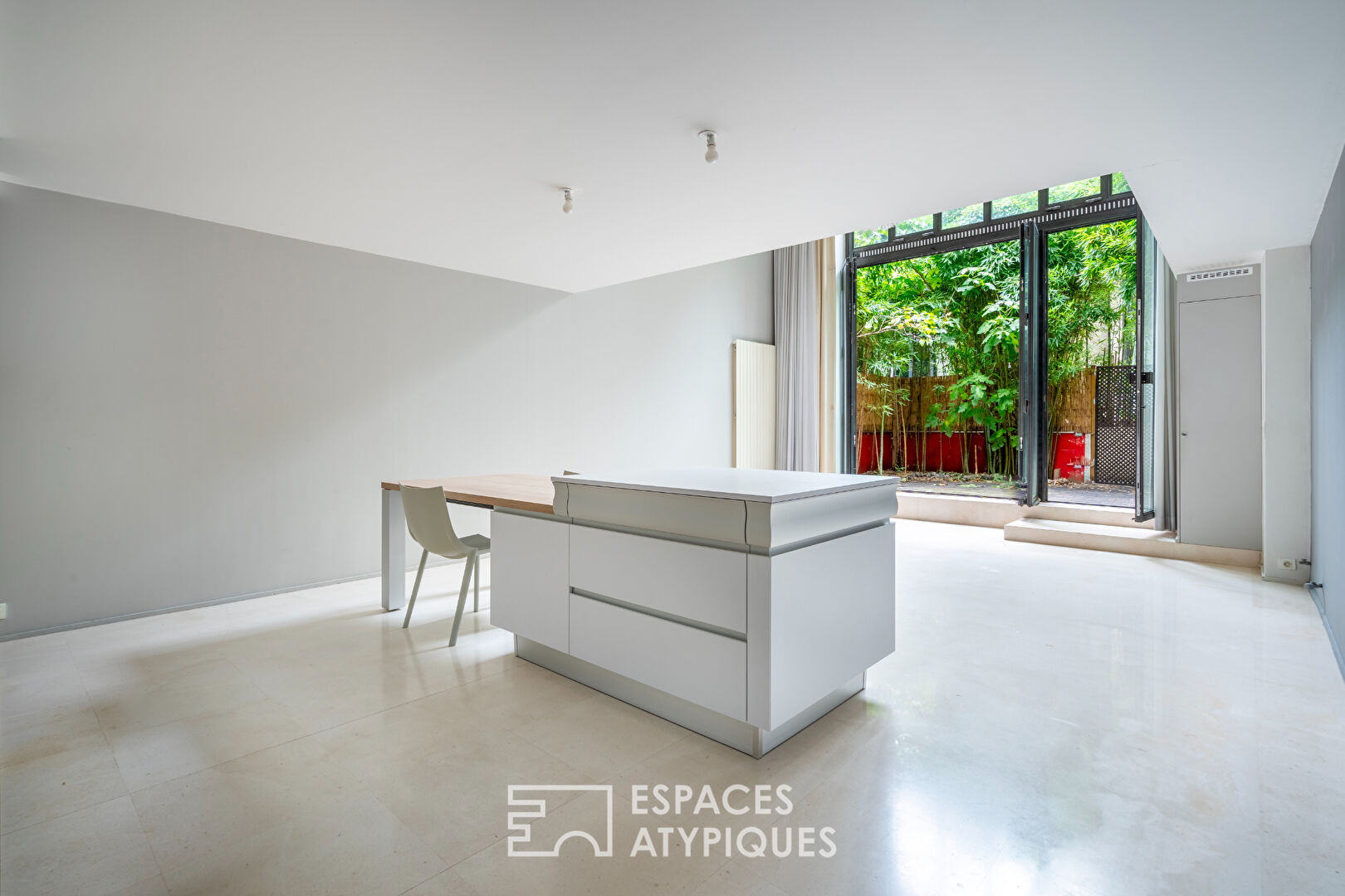 Loft en duplex avec terrasse arborée