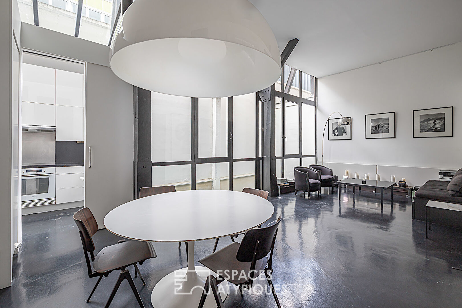 Monochrome duplex loft with patios