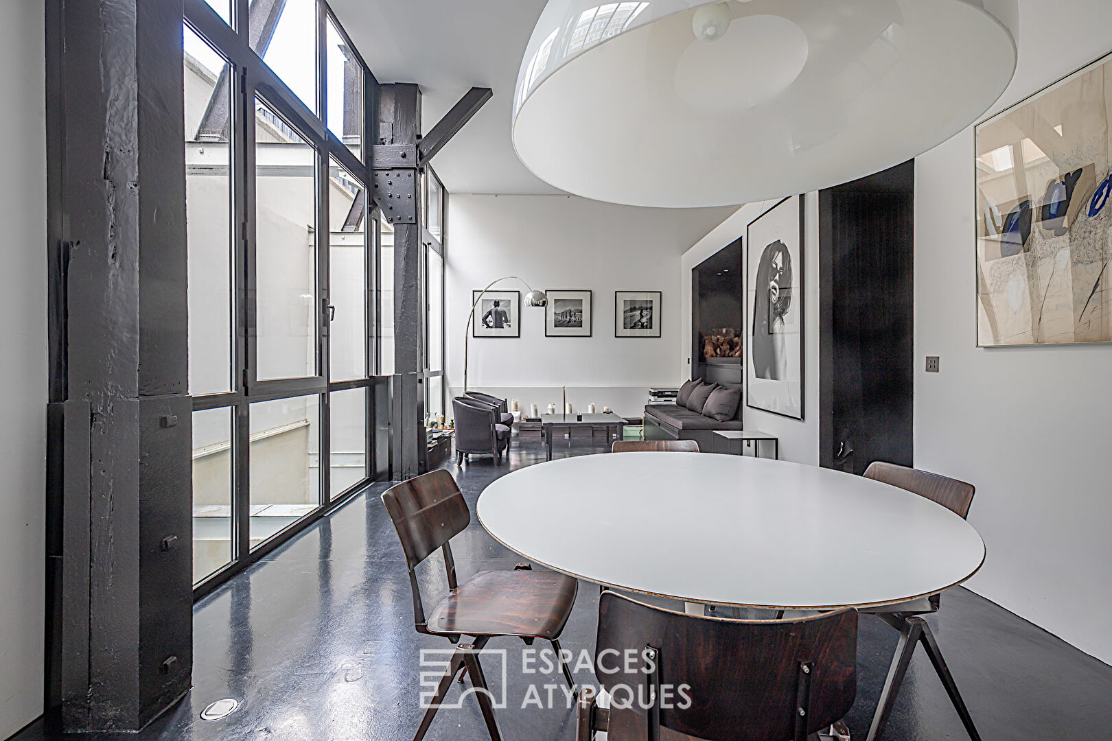 Monochrome duplex loft with patios