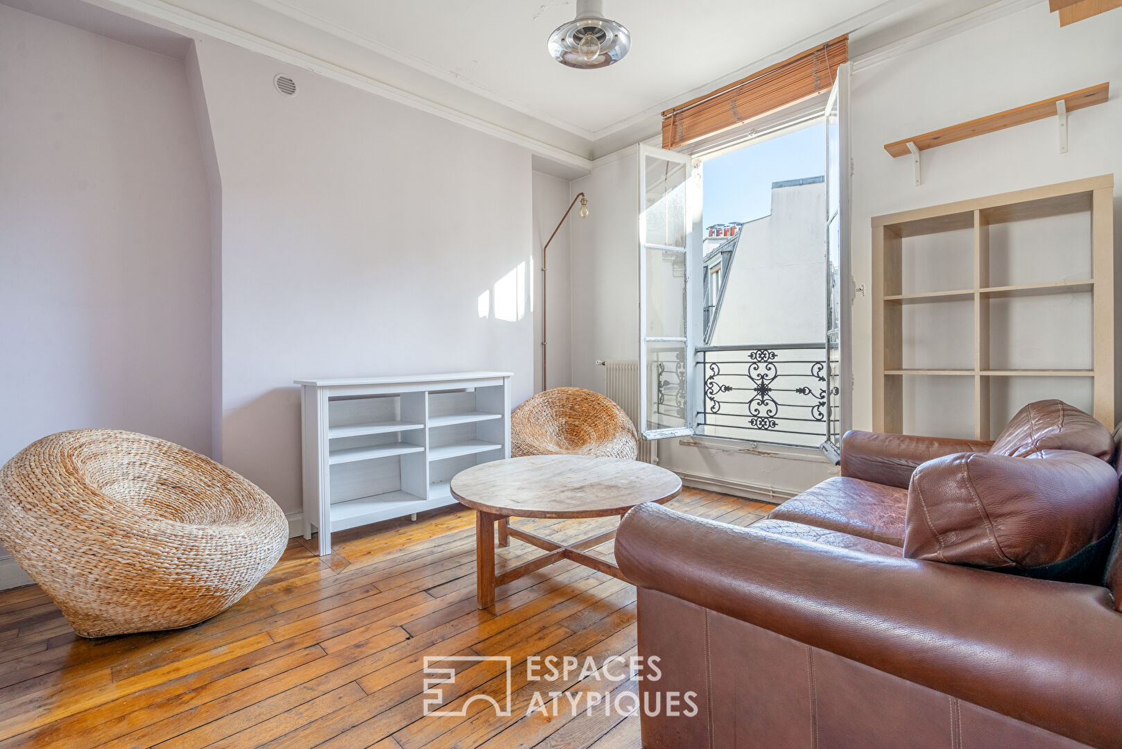 Haussmannian apartment with balcony and open view